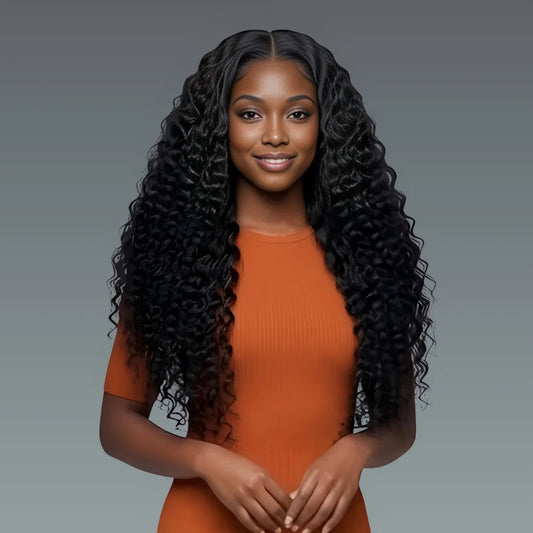 Woman with long, styled hair wearing an orange top against a gray background