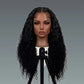 Mannequin head with long black curly wig on a gray background