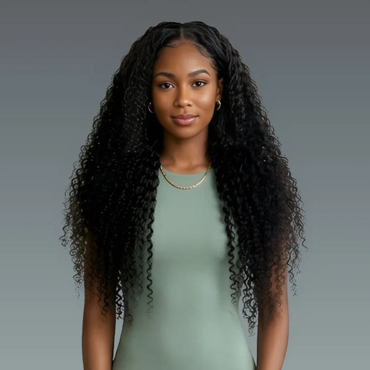 Woman with long, curly black hair wearing a green dress against a gray background