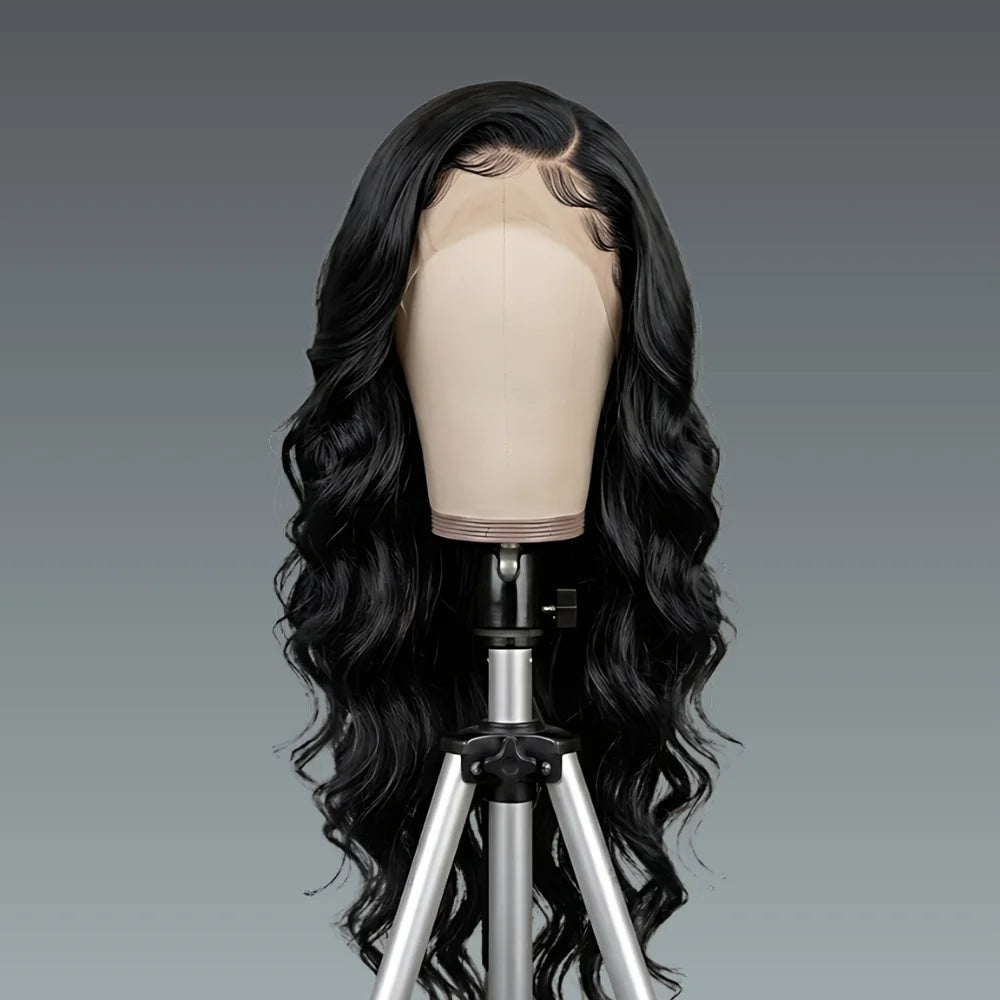 Black wig on a mannequin head against a gray background