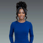 Woman wearing a blue outfit against a gray background