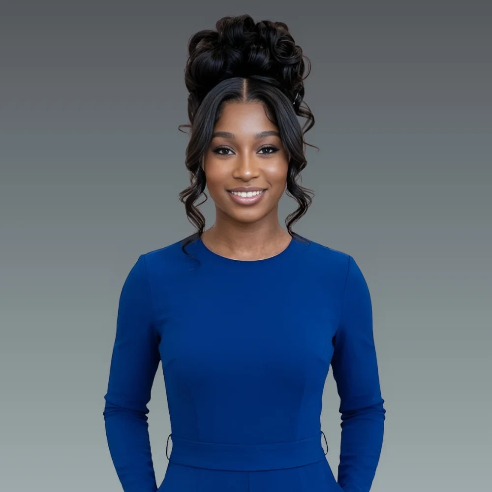 Woman wearing a blue outfit against a gray background