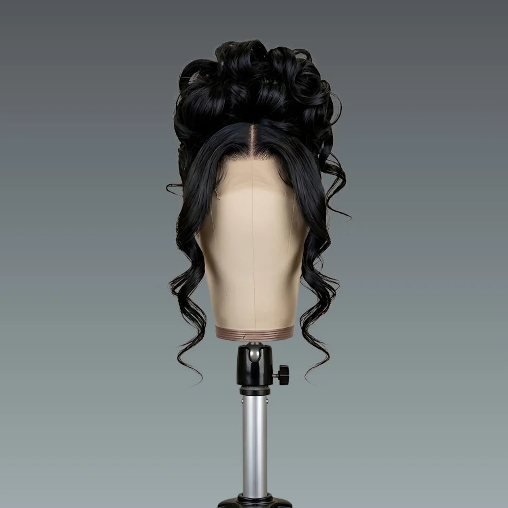 Black wavy wig on a mannequin head against a gray background