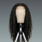 Black curly wig on a mannequin head against a gray background