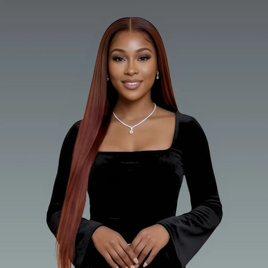 Woman with long straight hair wearing a black top against a gray background