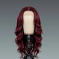 Red wig on a mannequin head against a gray background