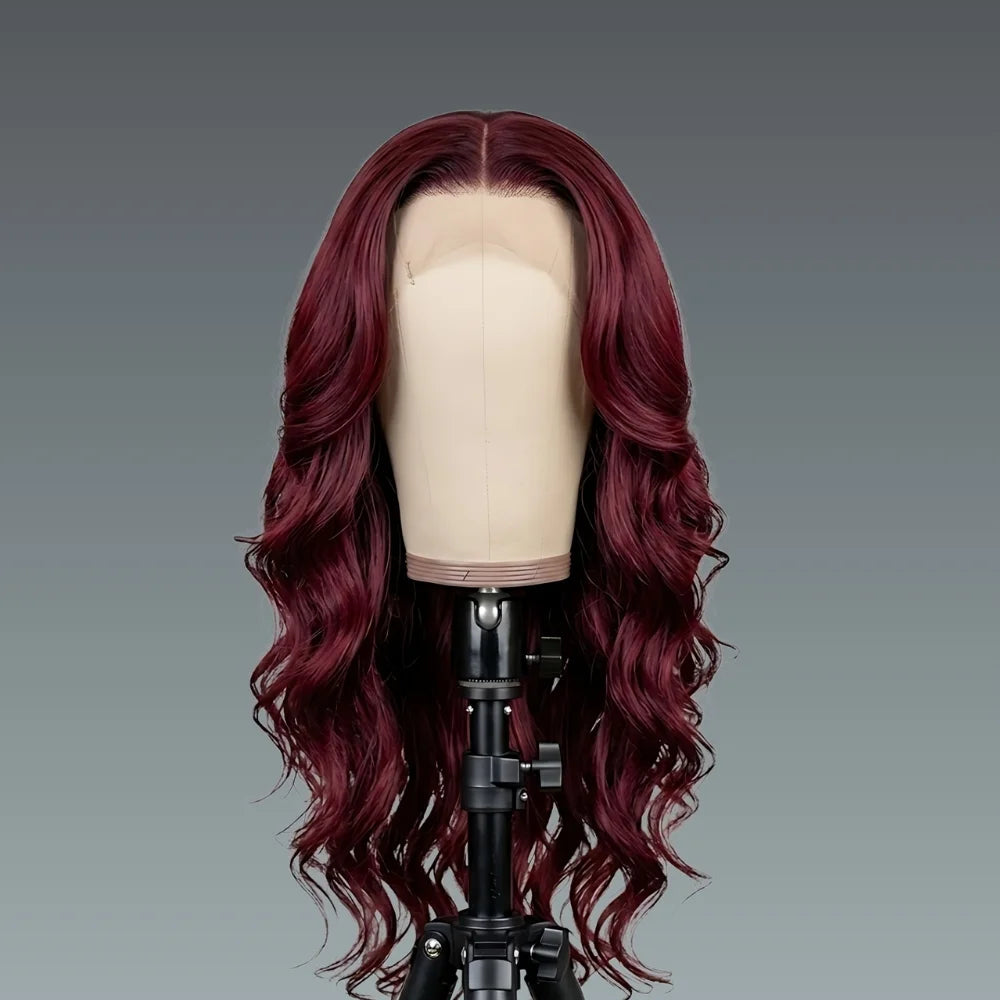 Red wig on a mannequin head against a gray background