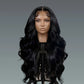 Black wig on a mannequin head against a gray background