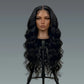 Black wavy wig on a mannequin head against a gray background