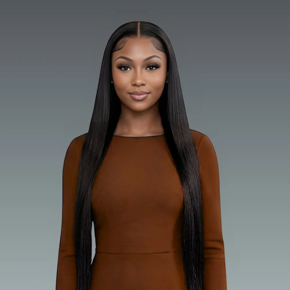 Woman wearing a brown dress against a gray background