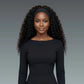 Woman wearing a black long-sleeve top against a gray background