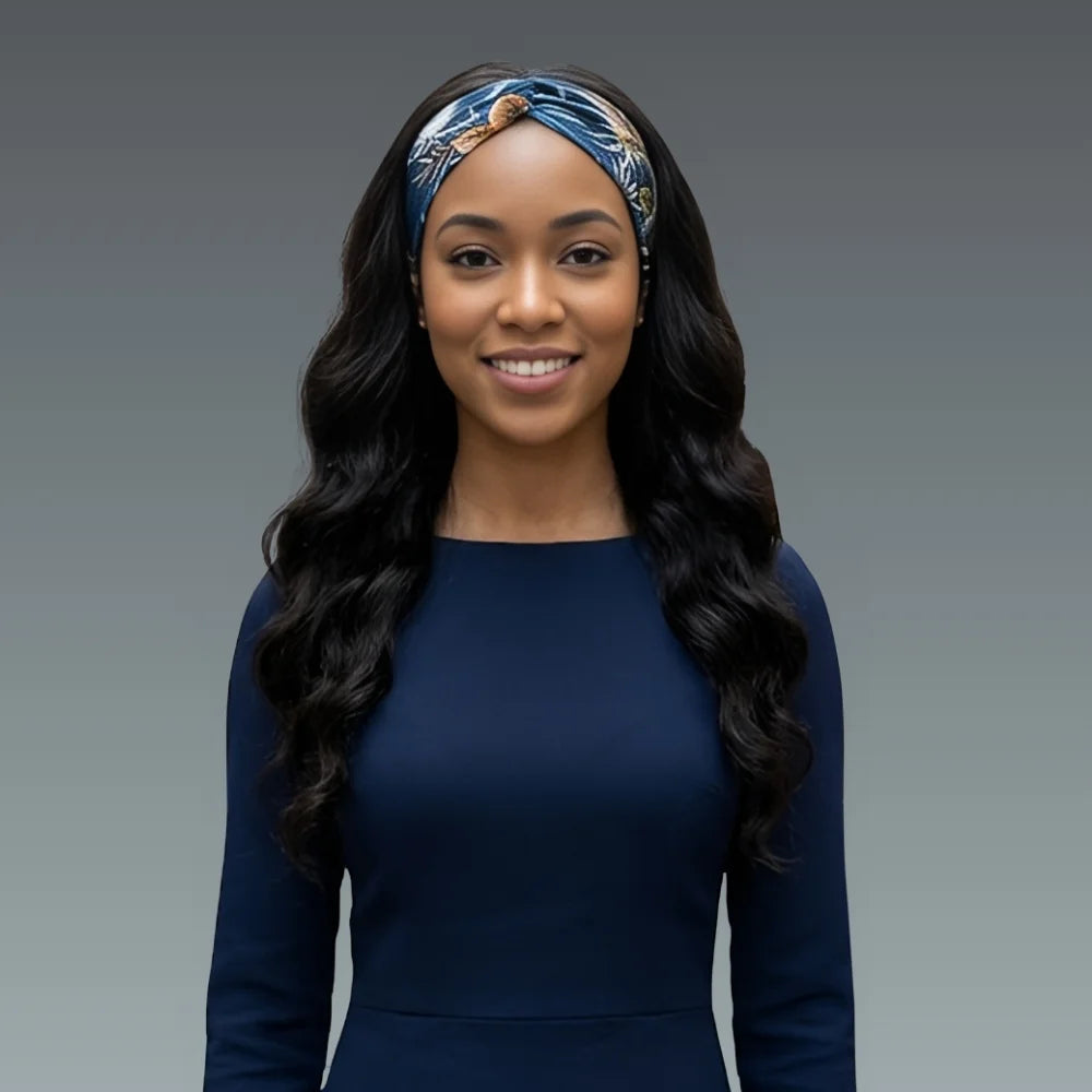 Woman wearing a blue dress and headband against a gray background