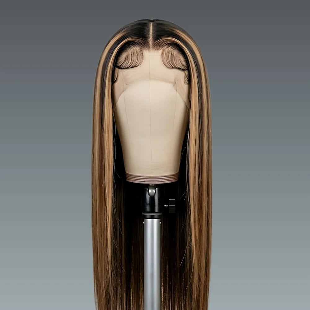 Brown wig on a mannequin head against a gray background