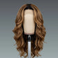 Brown wavy wig on a mannequin head against a gray background