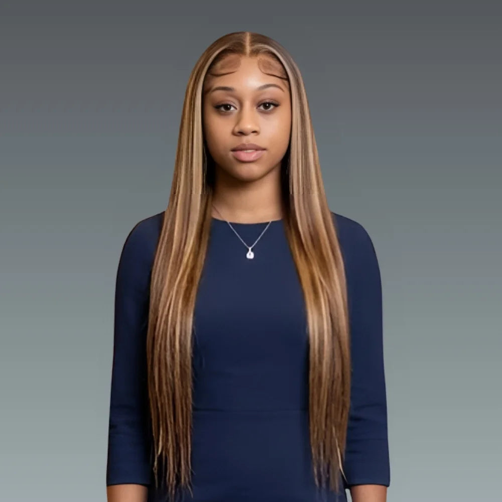 Woman with long straight hair wearing a navy blue outfit against a gray background