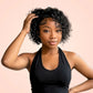 Model wearing a short pixie cut water wave lace front wig in natural black