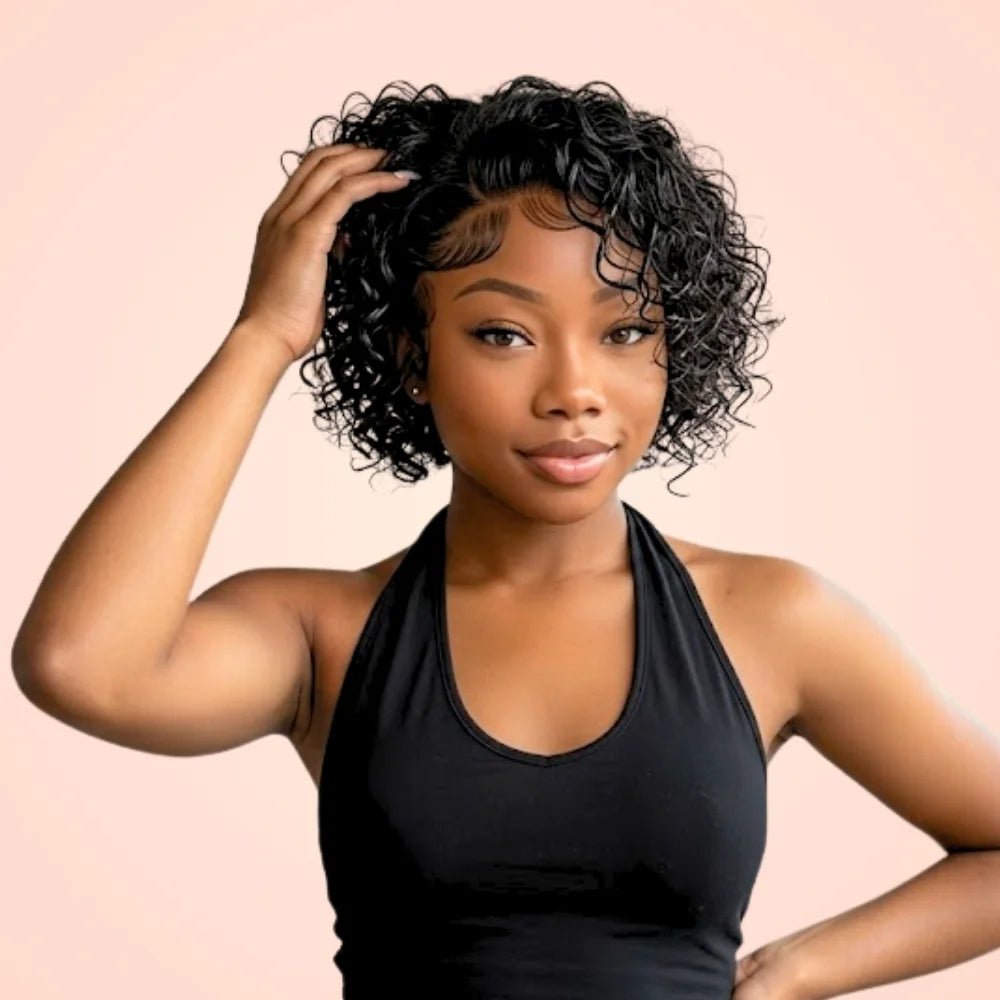 Model wearing a short pixie cut water wave lace front wig in natural black