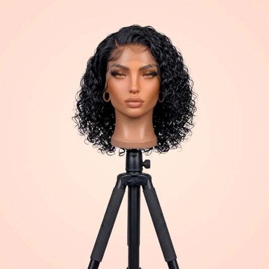 Pixie cut water wave transparent lace front wig displayed on a mannequin head